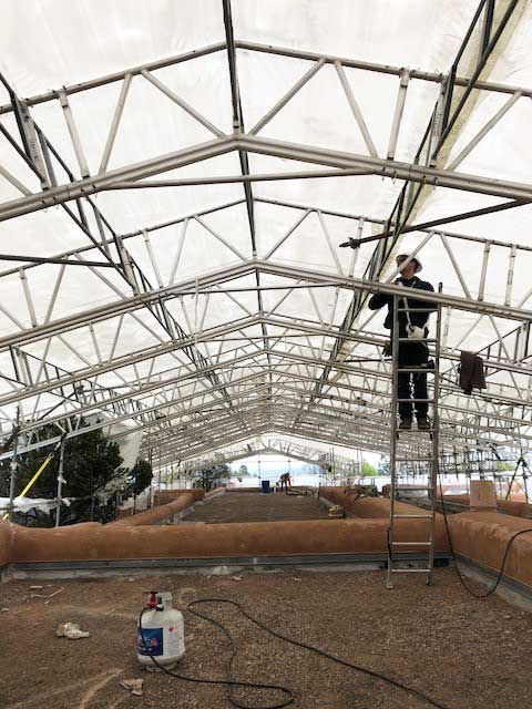 Underneath the 29,000 sqft roof cover with one of our tech reps